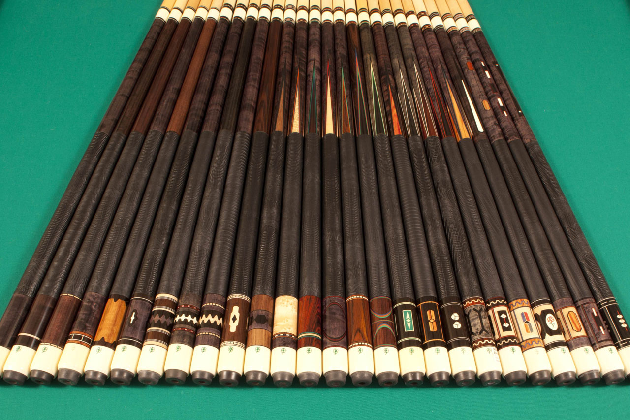 D-Series cues lined up on pool table